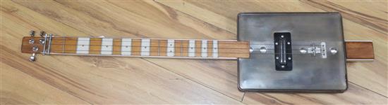 A three string cigar box guitar